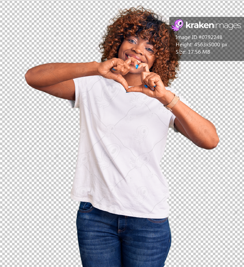 Young african american woman wearing casual white tshirt smiling in love doing heart symbol shape with hands. romantic concept.