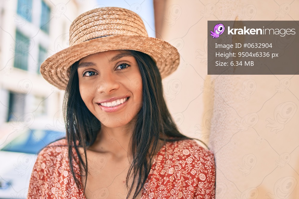 Young african american tourist woman on vacation smiling happy at the city.