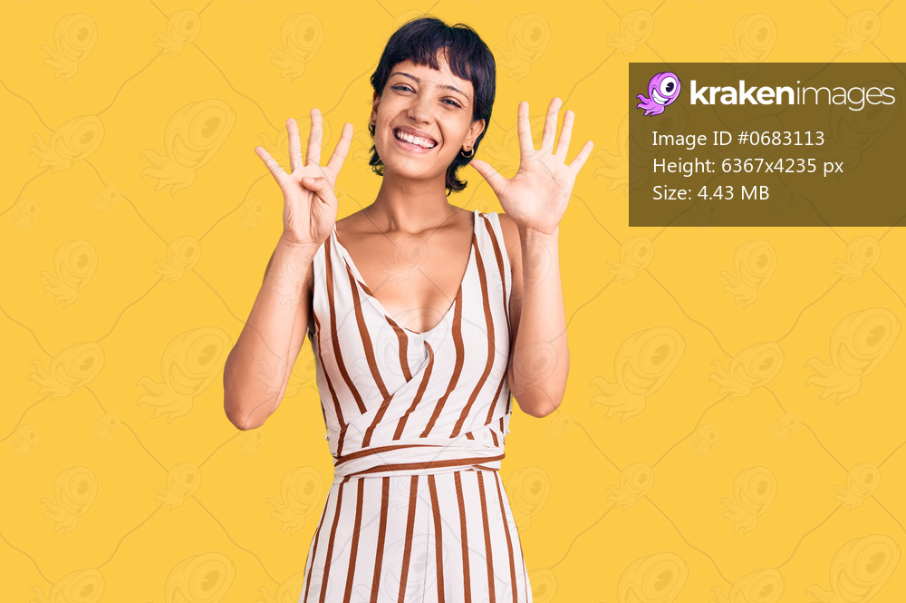 Young brunette woman with short hair wearing summer outfit showing and pointing up with fingers number nine while smiling confident and happy. 