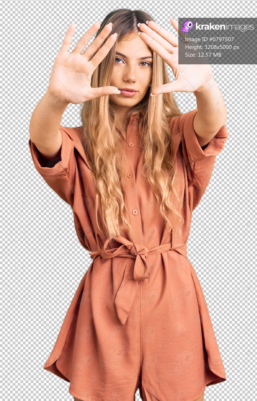 Beautiful caucasian woman with blonde hair wearing summer jumpsuit doing frame using hands palms and fingers, camera perspective