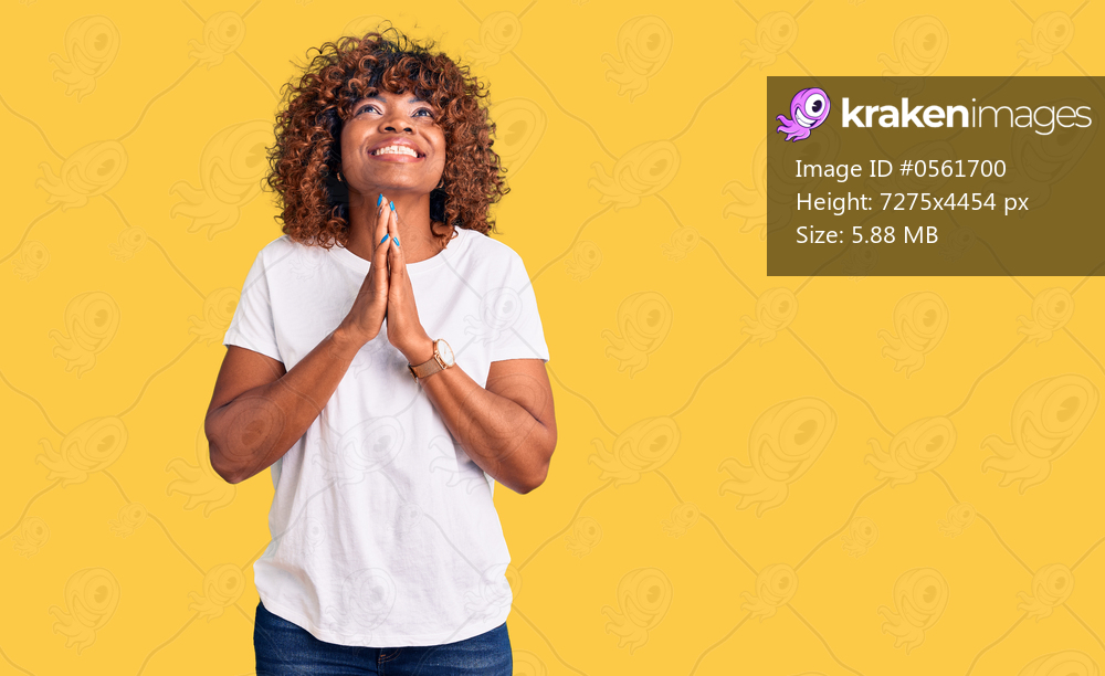 Young african american woman wearing casual white tshirt begging and praying with hands together with hope expression on face very emotional and worried. begging. 