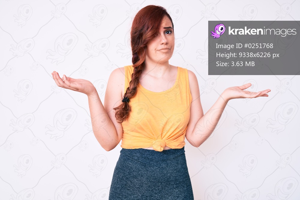 Young beautiful woman wearing casual clothes clueless and confused with open arms, no idea and doubtful face. 