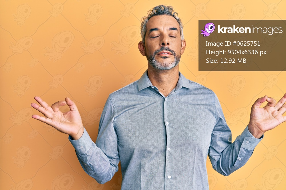 Middle age grey-haired man wearing casual clothes relax and smiling with eyes closed doing meditation gesture with fingers. yoga concept. 