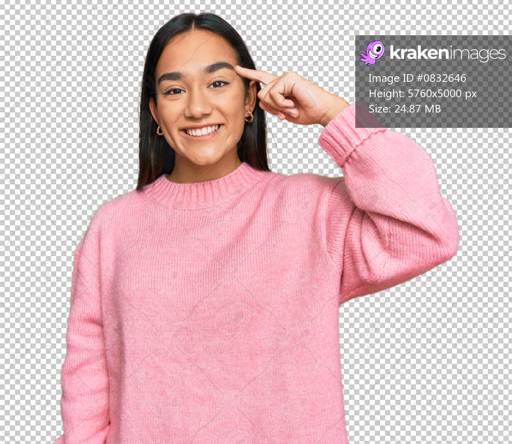 Young asian woman wearing casual winter sweater smiling pointing to head with one finger, great idea or thought, good memory