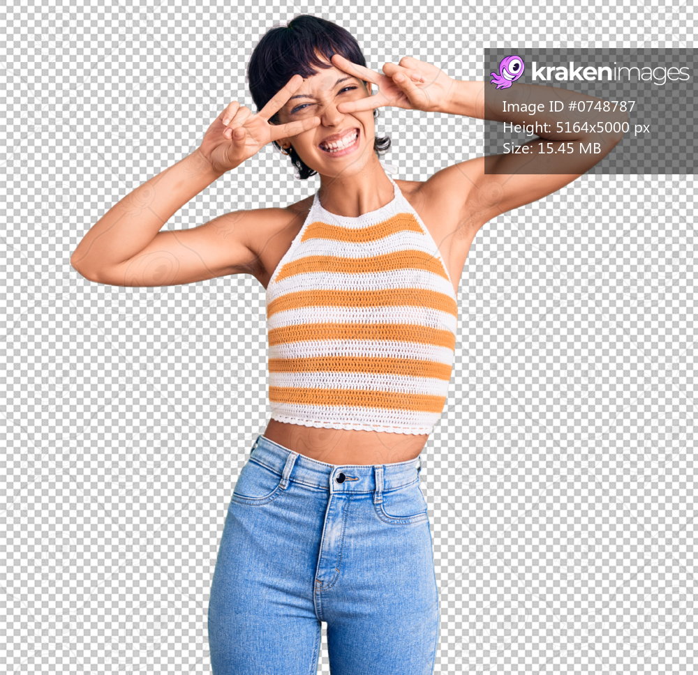 Young brunette woman with short hair wearing casual clothes doing peace symbol with fingers over face, smiling cheerful showing victory