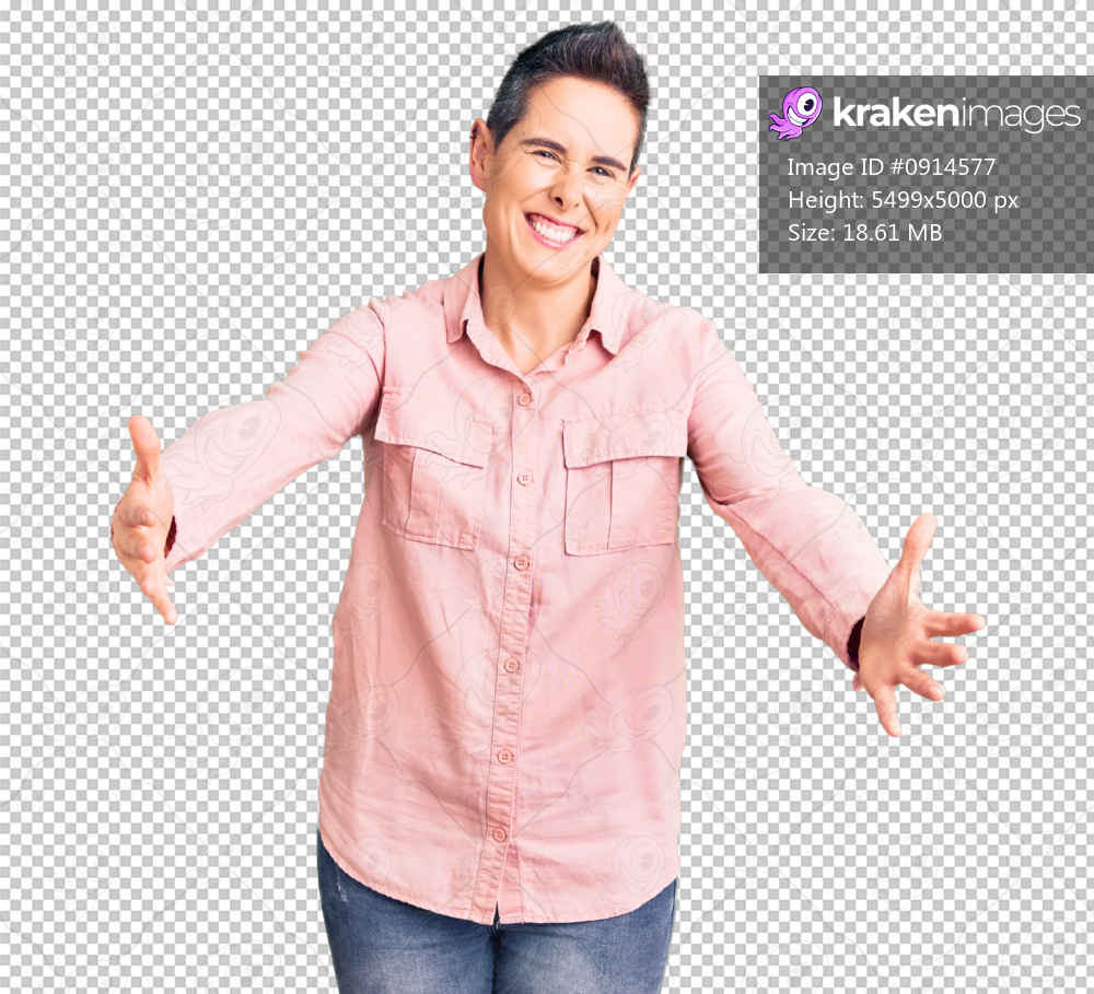 Young woman with short hair wearing casual clothes looking at the camera smiling with open arms for hug. cheerful expression embracing happiness.