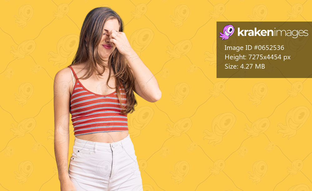 Beautiful caucasian young woman wearing casual clothes tired rubbing nose and eyes feeling fatigue and headache. stress and frustration concept. 