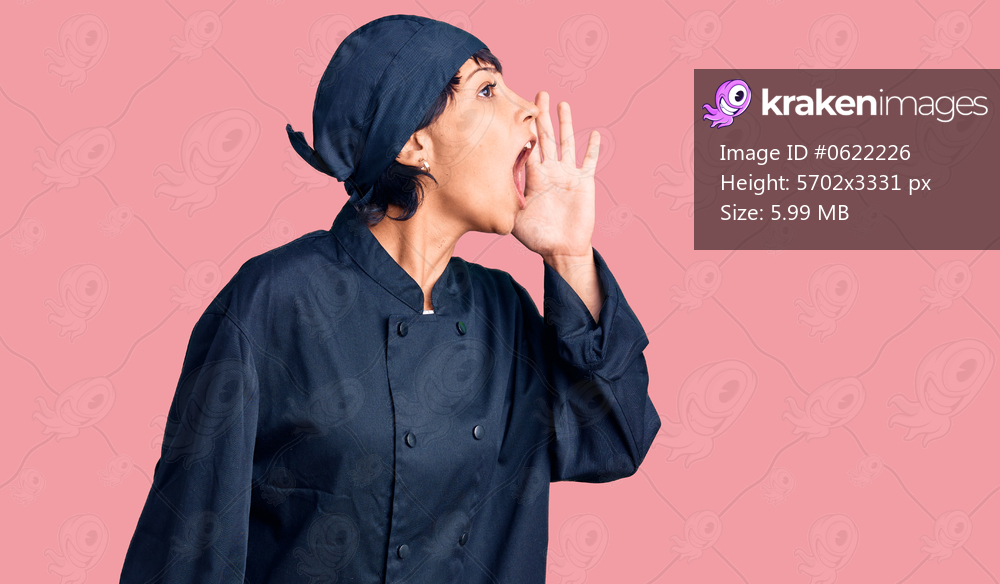 Young brunette woman with short hair wearing professional cook uniform shouting and screaming loud to side with hand on mouth. communication concept. 