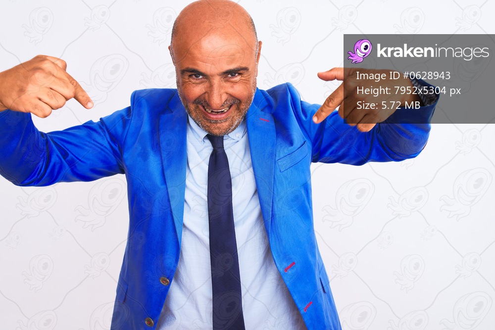 Middle age businessman wearing suit standing over isolated white background looking confident with smile on face, pointing oneself with fingers proud and happy.