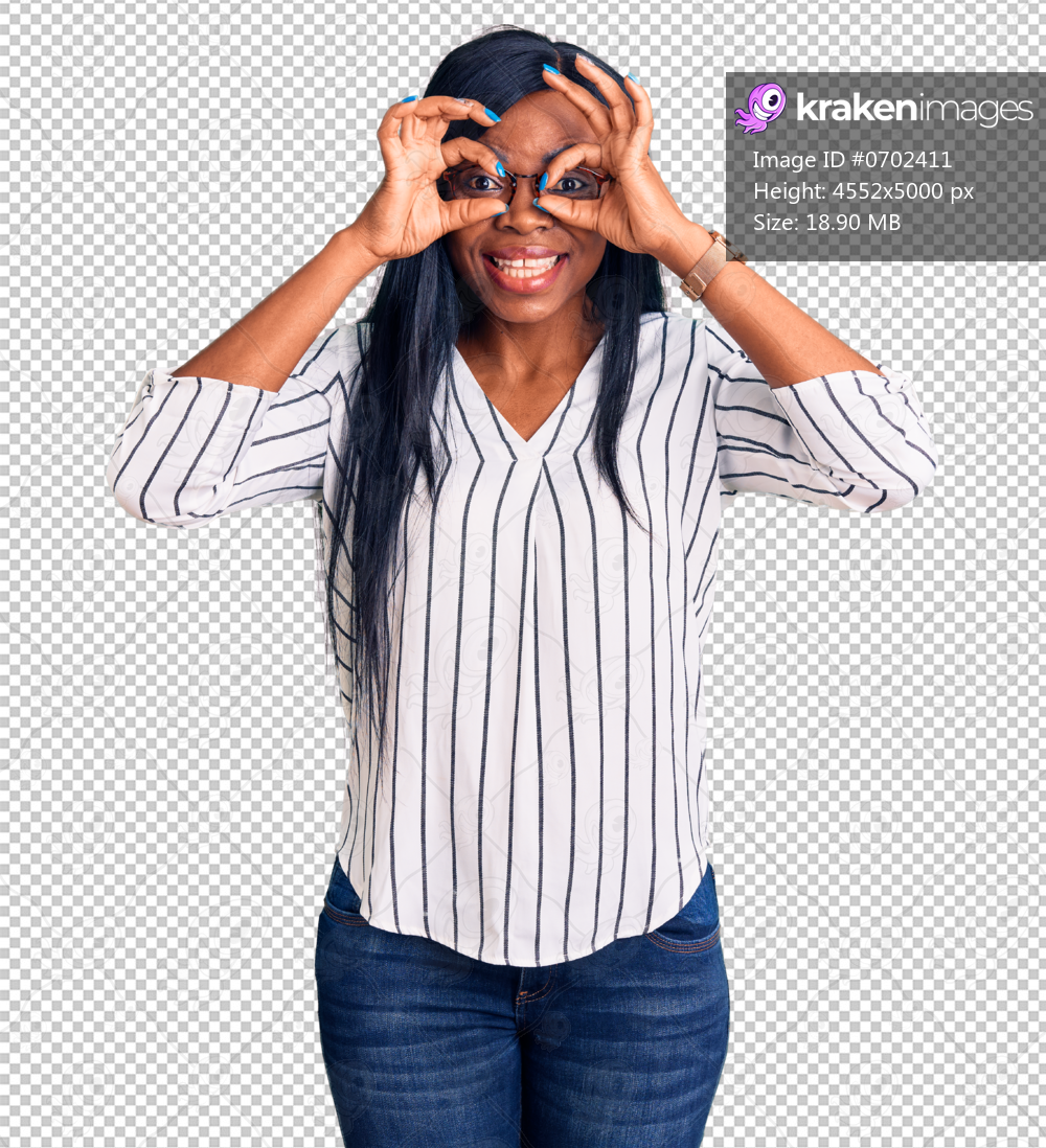 Young african american woman wearing casual clothes and glasses doing ok gesture like binoculars sticking tongue out, eyes looking through fingers. crazy expression.