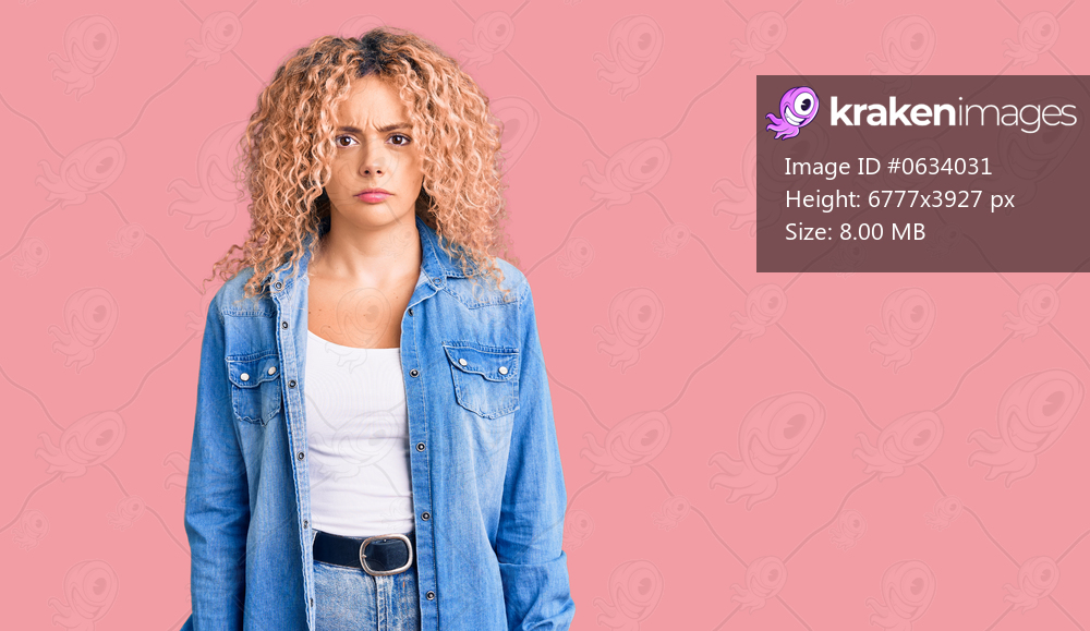 Young blonde woman with curly hair wearing casual denim jacket skeptic and nervous, frowning upset because of problem. negative person. 