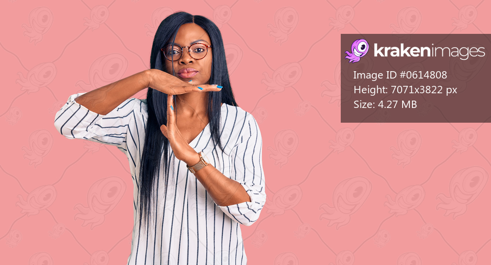 Young african american woman wearing casual clothes and glasses doing time out gesture with hands, frustrated and serious face 