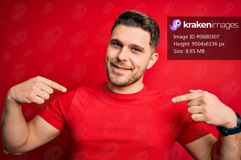 Young man with blue eyes wearing casual t-shirt over red isolated background looking confident with smile on face, pointing oneself with fingers proud and happy.