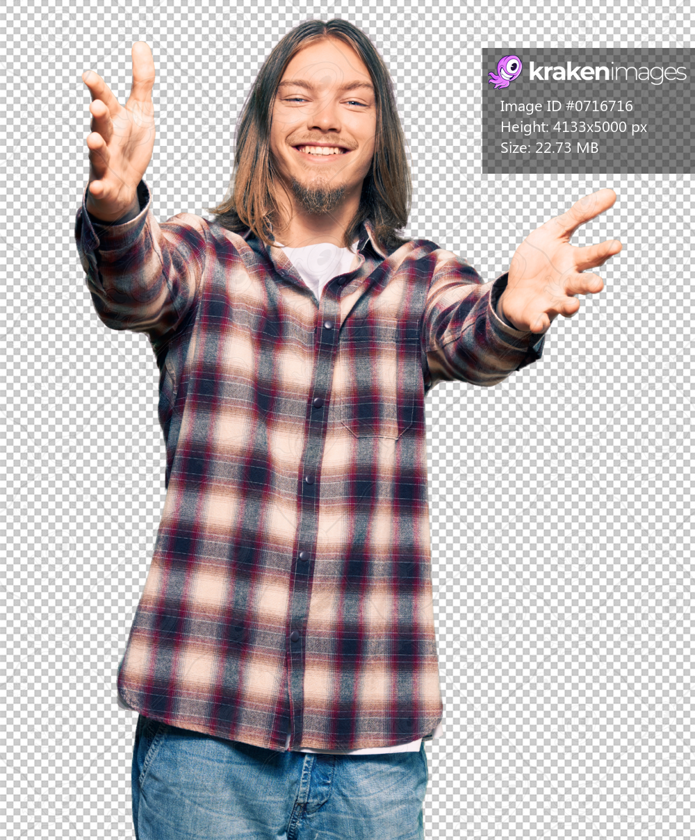 Handsome caucasian man with long hair wearing hipster shirt looking at the camera smiling with open arms for hug. cheerful expression embracing happiness.