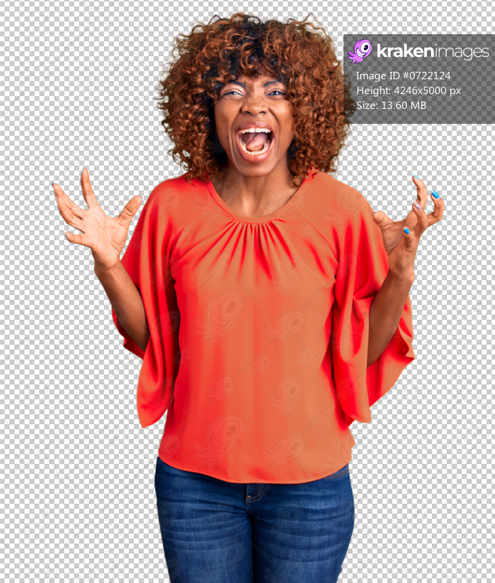 Young african american woman wearing casual clothes crazy and mad shouting and yelling with aggressive expression and arms raised. frustration concept.
