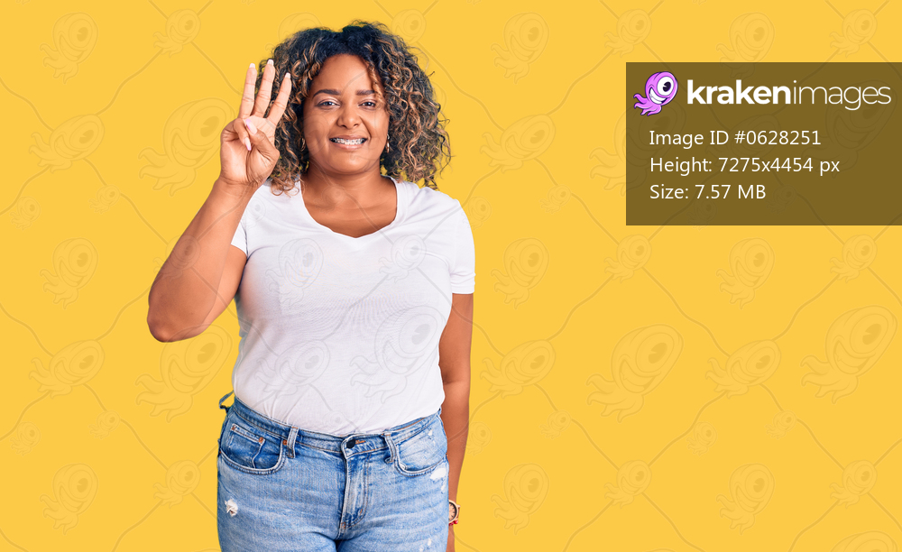 Young african american plus size woman wearing casual clothes showing and pointing up with fingers number three while smiling confident and happy. 