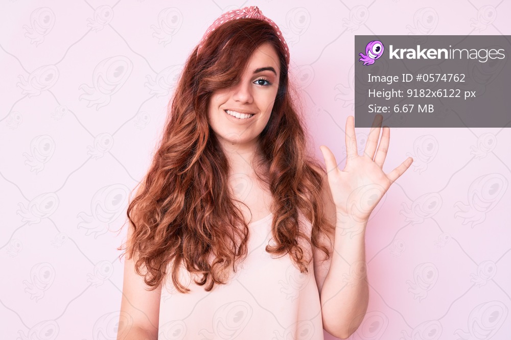 Young beautiful woman wearing casual clothes showing and pointing up with fingers number five while smiling confident and happy. 