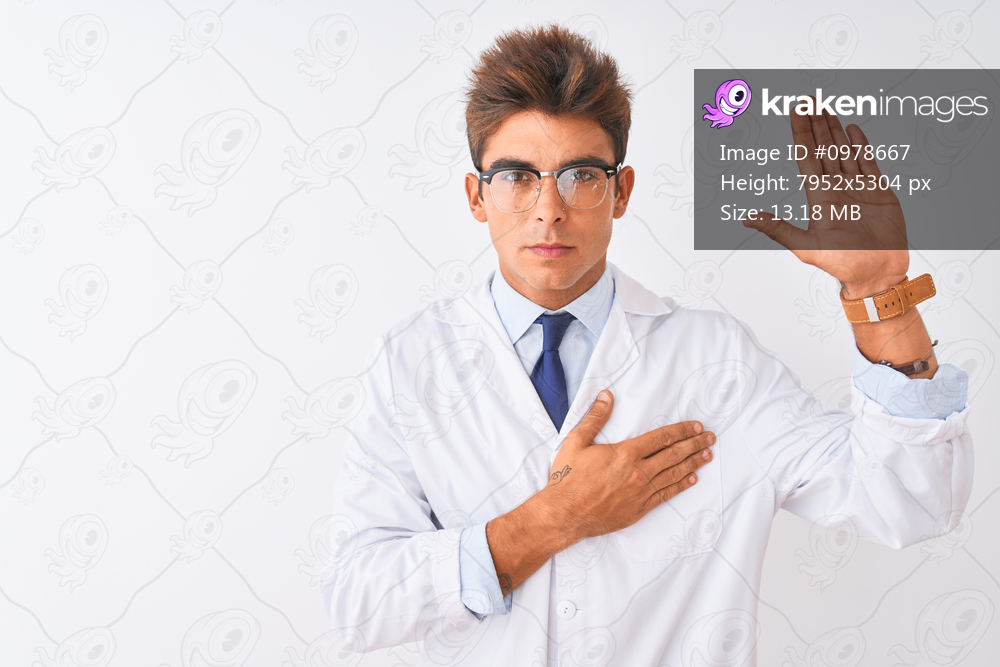 Young handsome sciencist man wearing glasses and coat over isolated white background Swearing with hand on chest and open palm, making a loyalty promise oath
