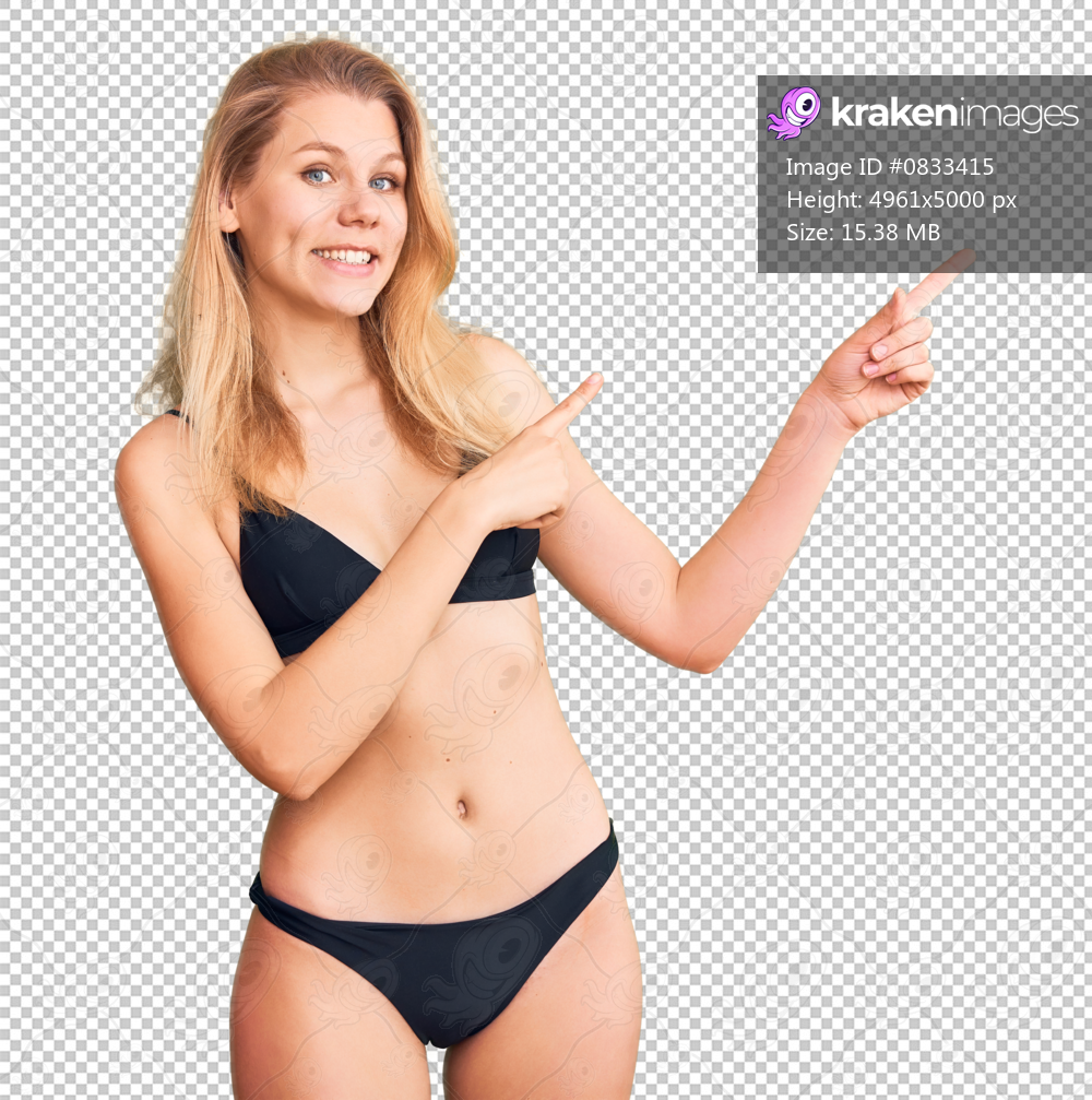 Young beautiful blonde woman wearing bikini smiling and looking at the camera pointing with two hands and fingers to the side.