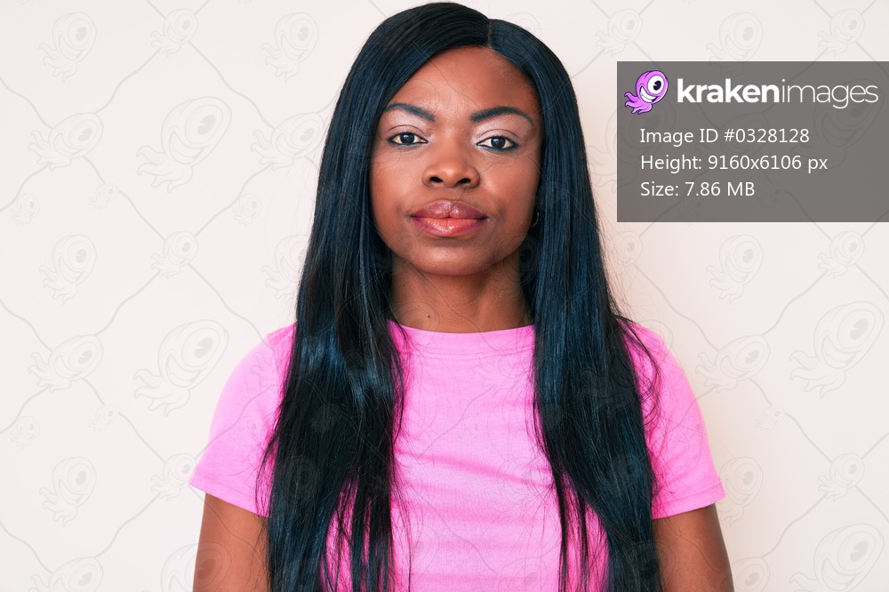 Young african american woman wearing casual clothes with serious expression on face. simple and natural looking at the camera. 