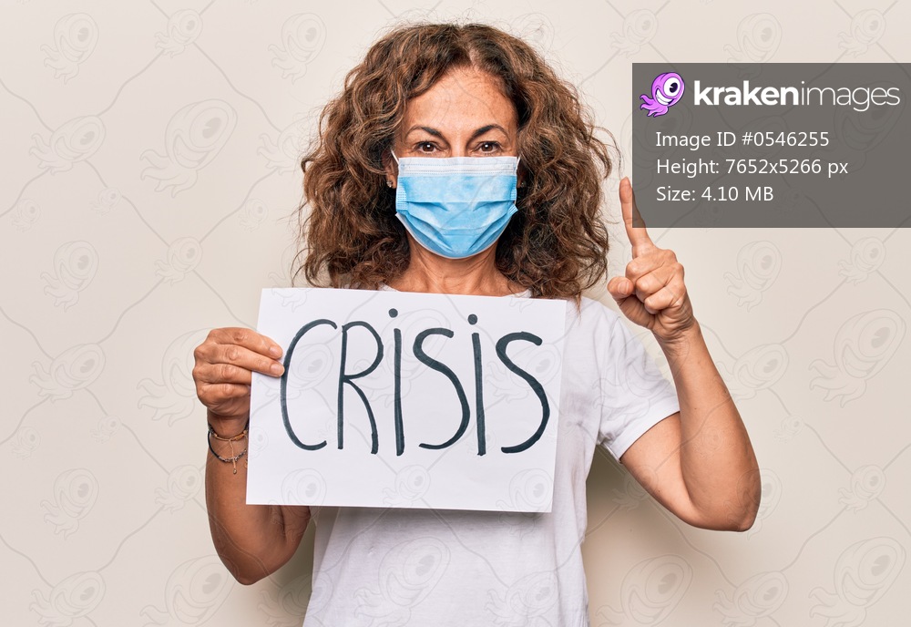 Middle age woman wearing coronavirus protection mask holding epidemic crisis paper as protest smiling with an idea or question pointing finger with happy face, number one