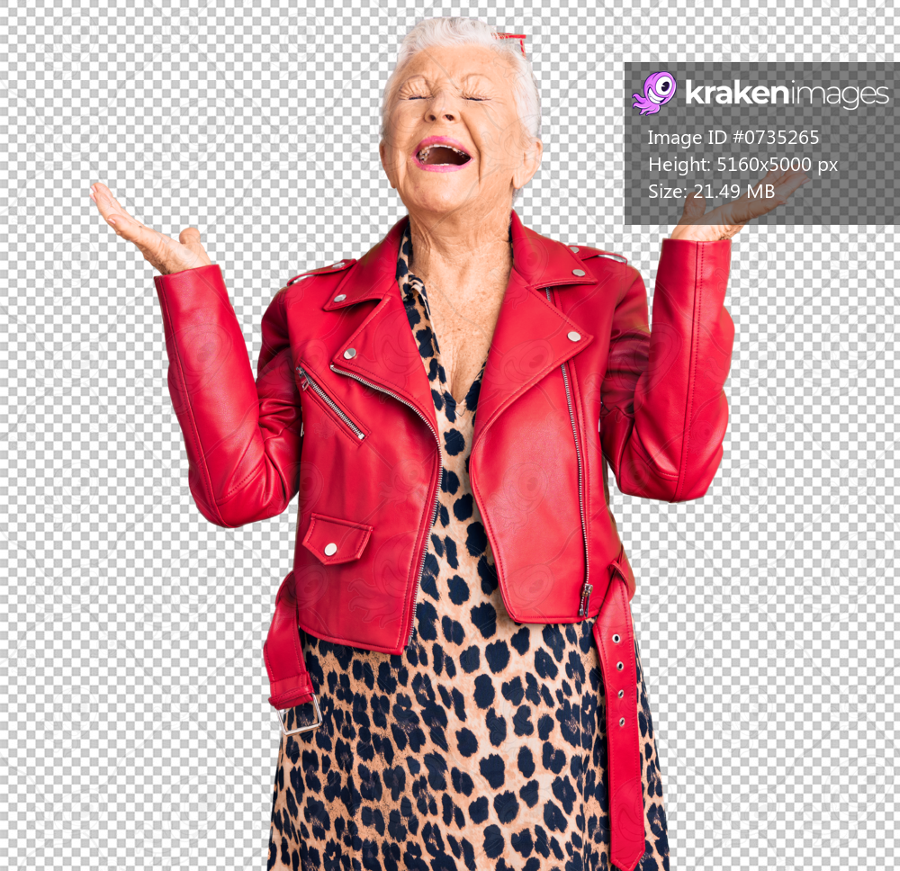Senior beautiful woman with blue eyes and grey hair wearing a modern style with a red leather jacket celebrating mad and crazy for success with arms raised and closed eyes screaming excited. winner concept