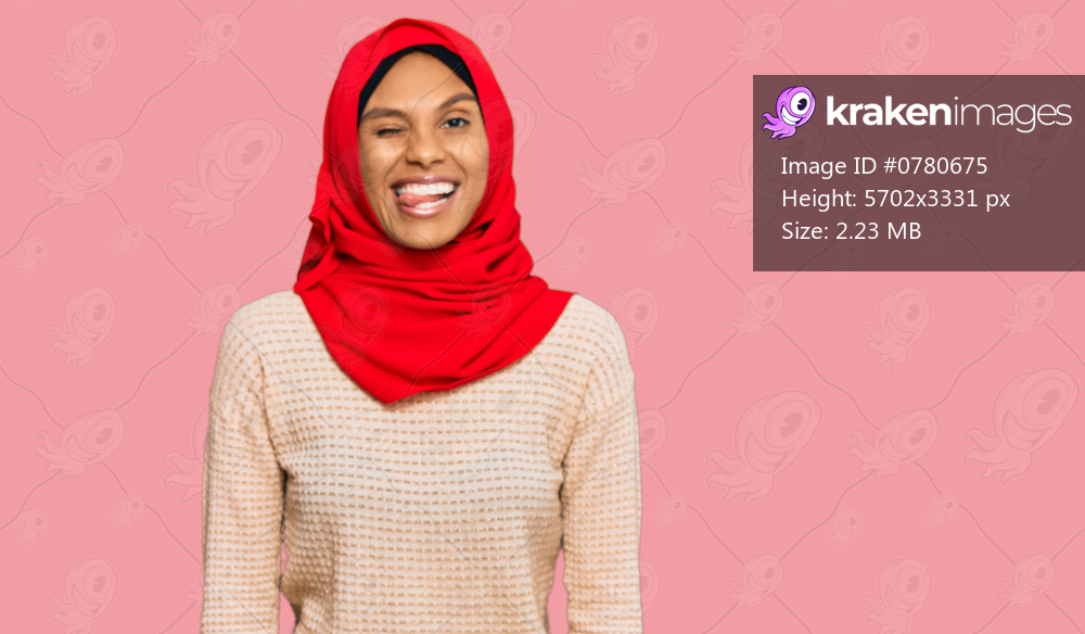 Young african american woman wearing traditional islamic hijab scarf winking looking at the camera with sexy expression, cheerful and happy face. 