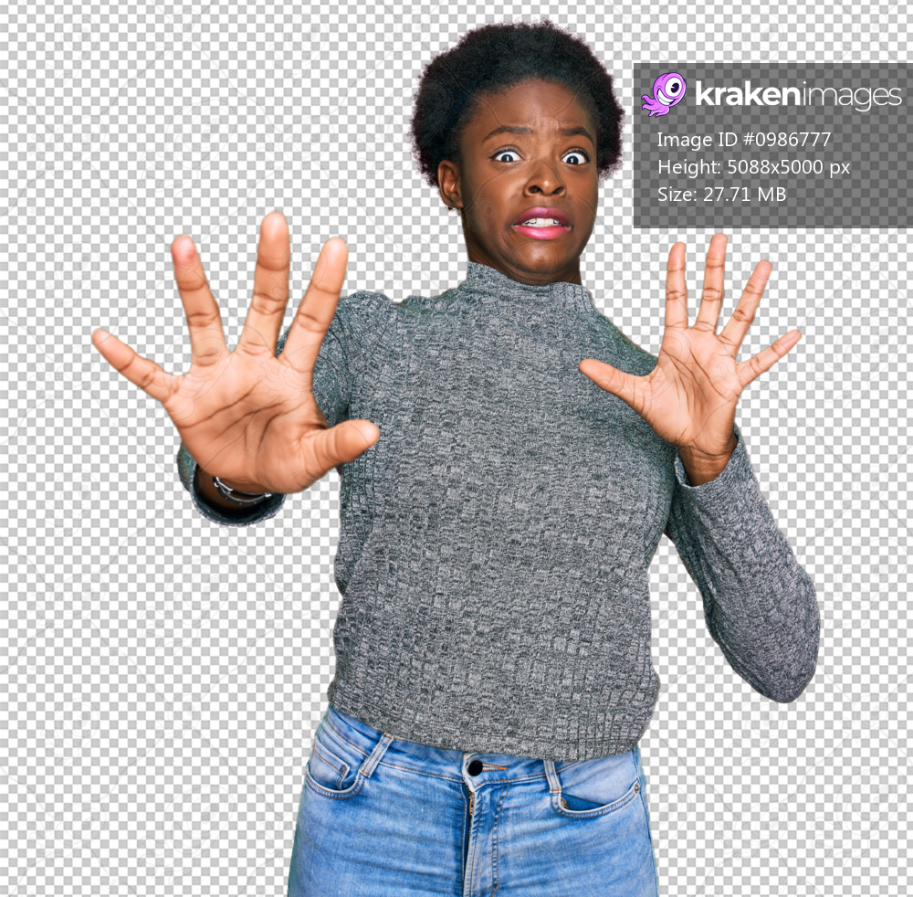 Young african american girl wearing casual clothes afraid and terrified with fear expression stop gesture with hands, shouting in shock. panic concept.