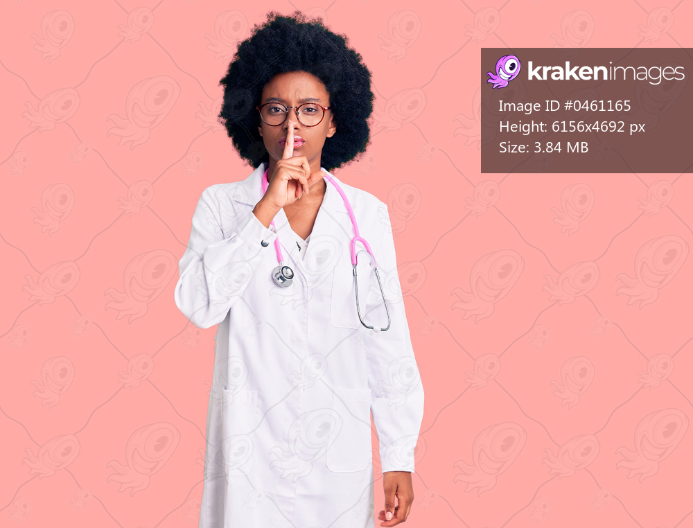 Young african american woman wearing doctor coat and stethoscope asking to be quiet with finger on lips. silence and secret concept. 