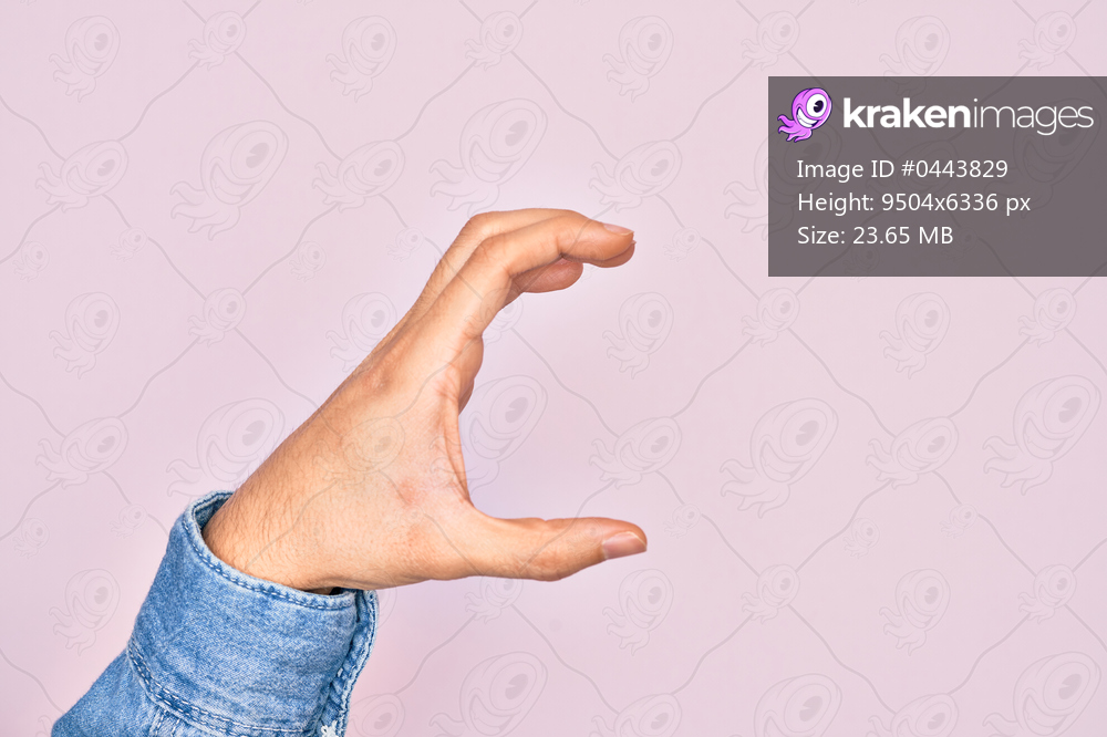 Hand of caucasian young man showing fingers over isolated pink background picking and taking invisible thing, holding object with fingers showing space