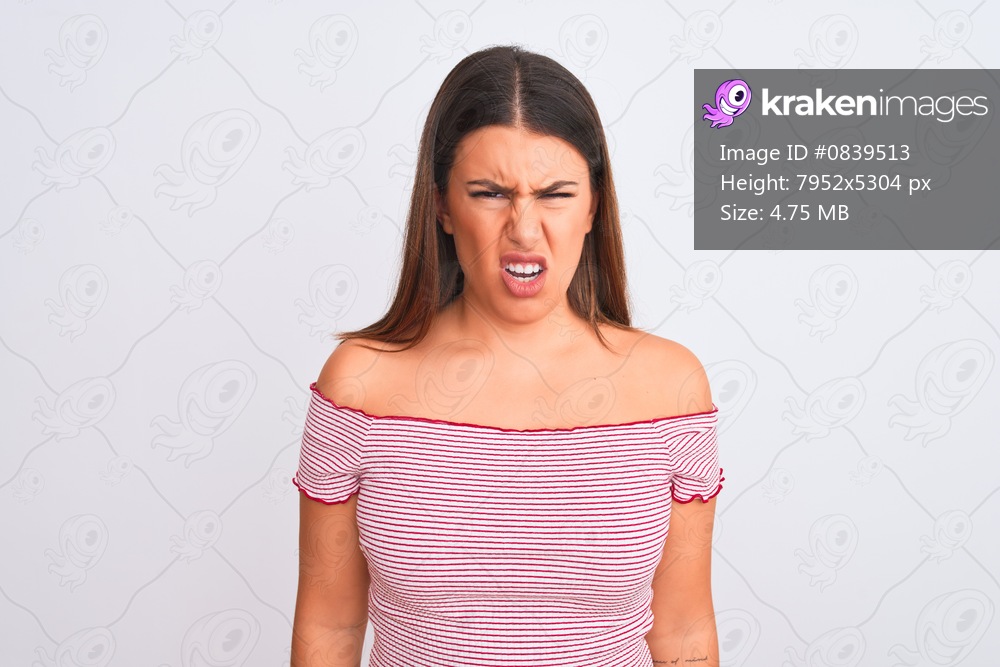 Portrait of beautiful young woman standing over isolated white background skeptic and nervous, frowning upset because of problem. Negative person.
