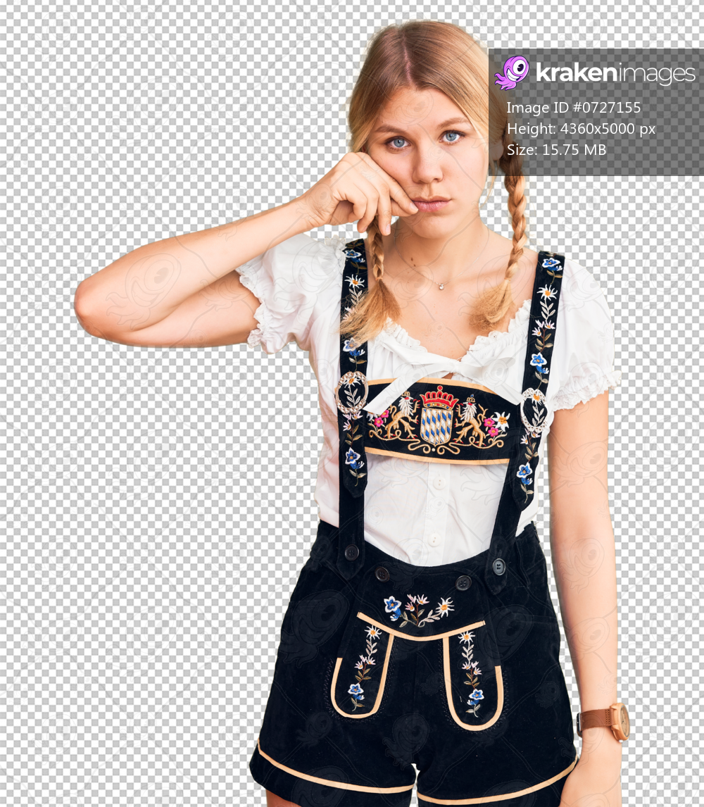 Young beautiful blonde woman wearing oktoberfest dress mouth and lips shut as zip with fingers. secret and silent, taboo talking