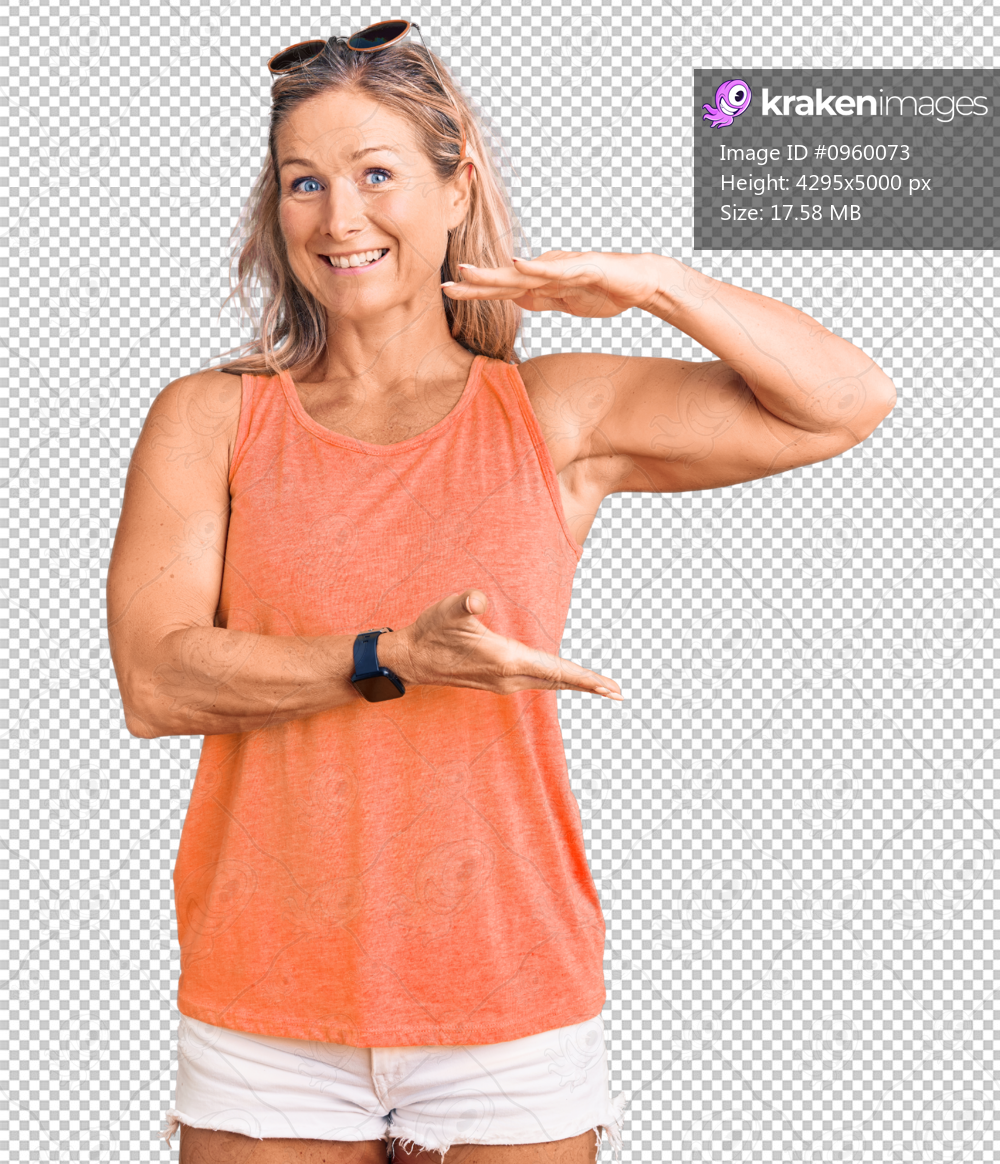 Middle age fit blonde woman wearing casual summer clothes and sunglasses gesturing with hands showing big and large size sign, measure symbol. smiling looking at the camera. measuring concept.