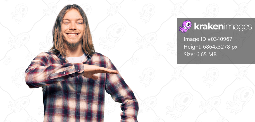 Handsome caucasian man with long hair wearing hipster shirt gesturing with hands showing big and large size sign, measure symbol. smiling looking at the camera. measuring concept. 