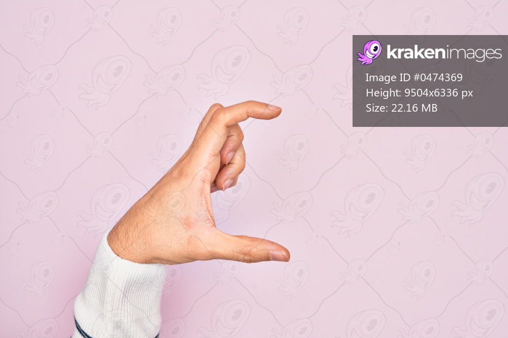 Hand of caucasian young man showing fingers over isolated pink background picking and taking invisible thing, holding object with fingers showing space