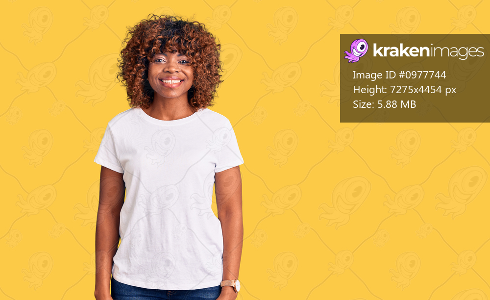 Young african american woman wearing casual white tshirt with a happy and cool smile on face. lucky person. 