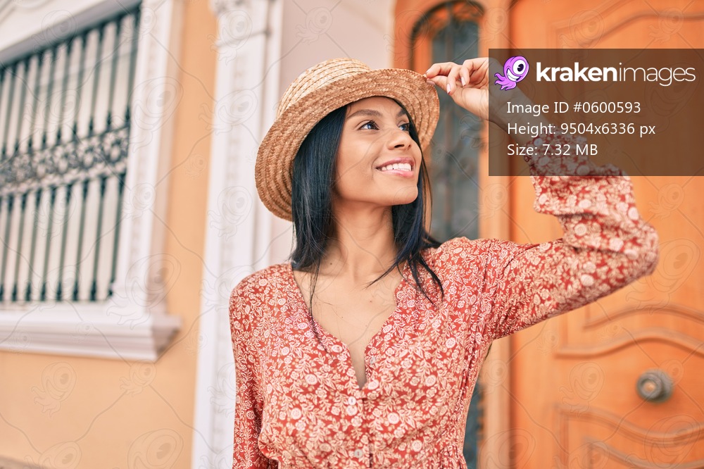 Young african american tourist woman on vacation smiling happy walking at the city.