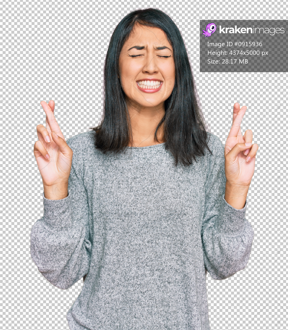 Beautiful asian young woman wearing casual clothes gesturing finger crossed smiling with hope and eyes closed. luck and superstitious concept.