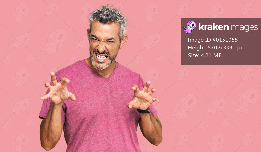 Middle age grey-haired man wearing casual clothes smiling funny doing claw gesture as cat, aggressive and sexy expression 