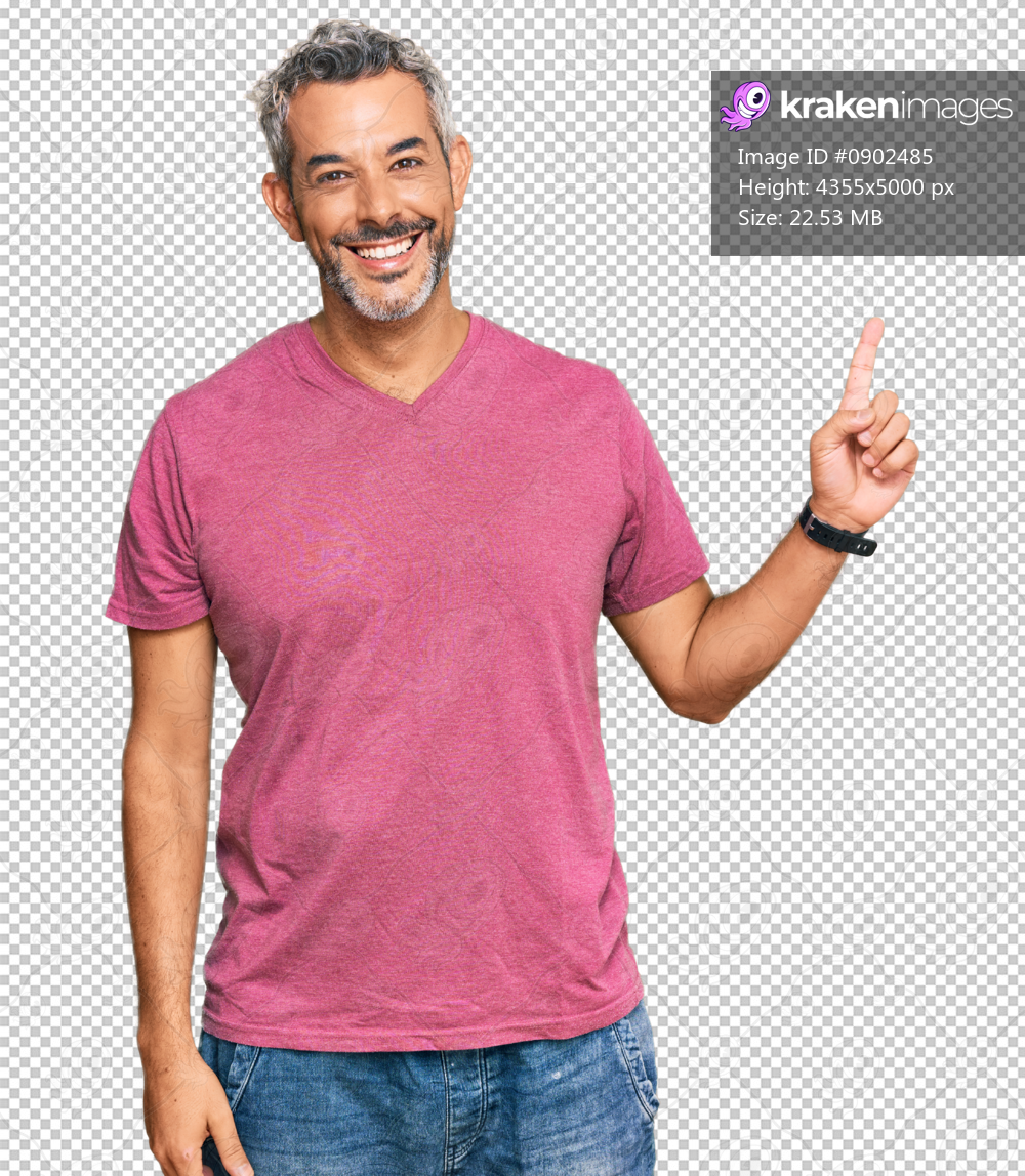 Middle age grey-haired man wearing casual clothes with a big smile on face, pointing with hand finger to the side looking at the camera.