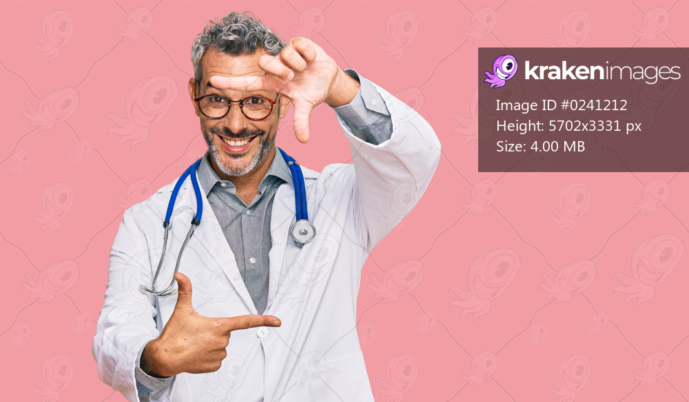 Middle age grey-haired man wearing doctor uniform and stethoscope smiling making frame with hands and fingers with happy face. creativity and photography concept. 