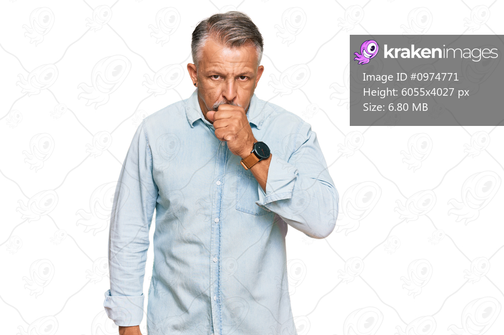 Middle age grey-haired man wearing casual clothes feeling unwell and coughing as symptom for cold or bronchitis. health care concept. 