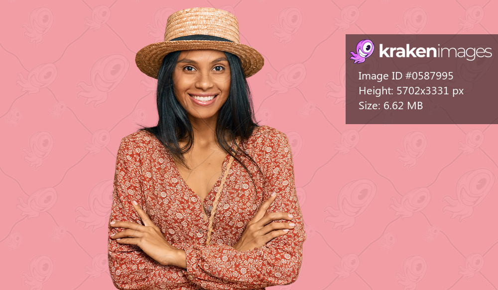 Young african american woman wearing summer hat happy face smiling with crossed arms looking at the camera. positive person. 