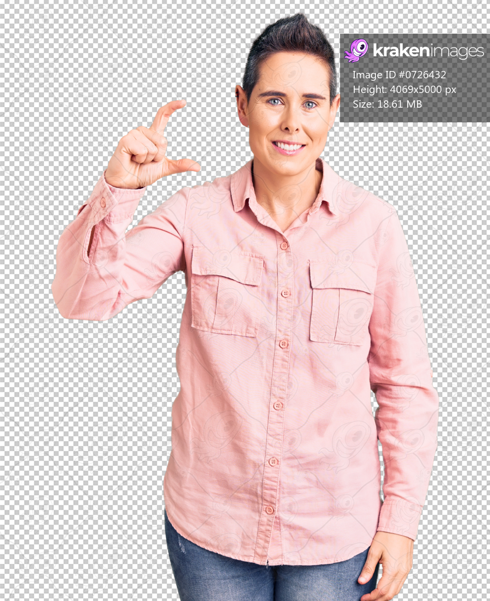 Young woman with short hair wearing casual clothes smiling and confident gesturing with hand doing small size sign with fingers looking and the camera. measure concept.