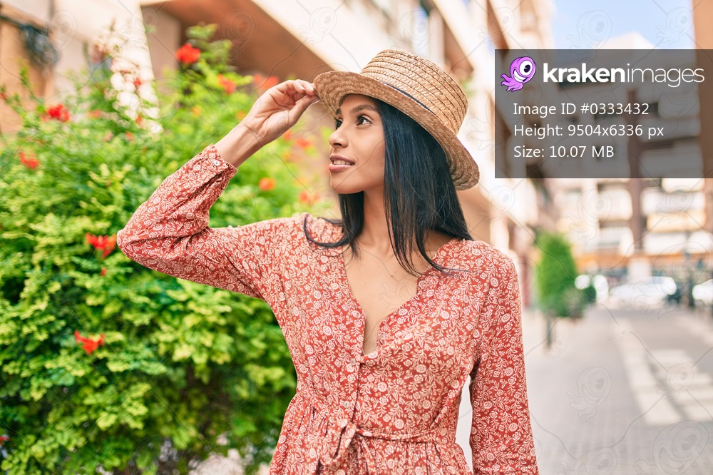 Young african american tourist woman on vacation smiling happy walking at the city.