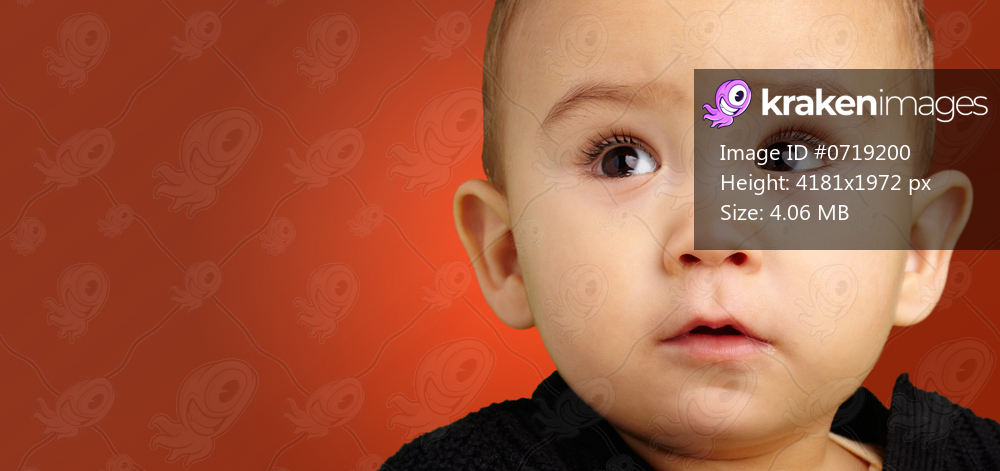 Portrait Of Baby Boy against a red background