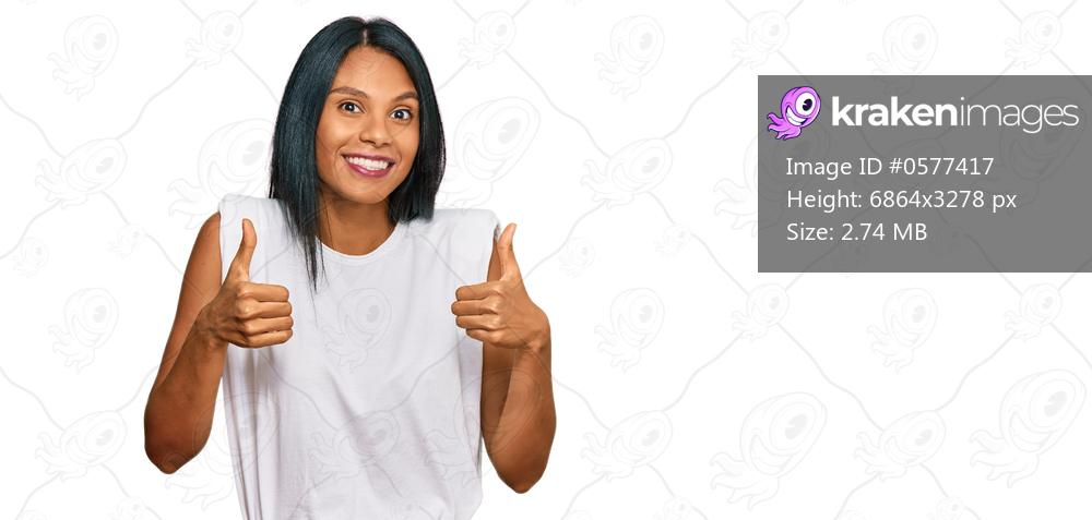 Young african american woman wearing casual clothes success sign doing positive gesture with hand, thumbs up smiling and happy. cheerful expression and winner gesture. 