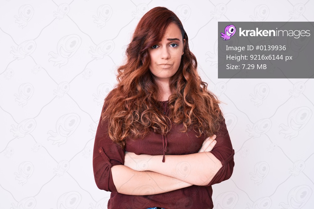 Young beautiful woman wearing casual clothes skeptic and nervous, disapproving expression on face with crossed arms. negative person. 