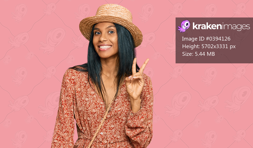 Young african american woman wearing summer hat showing and pointing up with fingers number two while smiling confident and happy. 