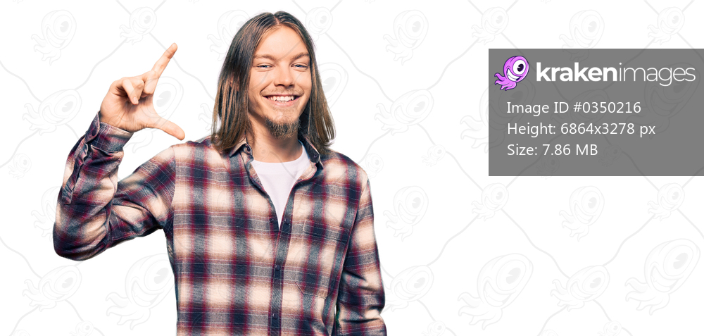Handsome caucasian man with long hair wearing hipster shirt smiling and confident gesturing with hand doing small size sign with fingers looking and the camera. measure concept. 